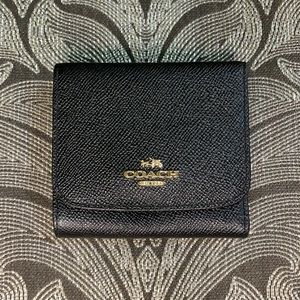 Black Coach trifold wallet with gold logo